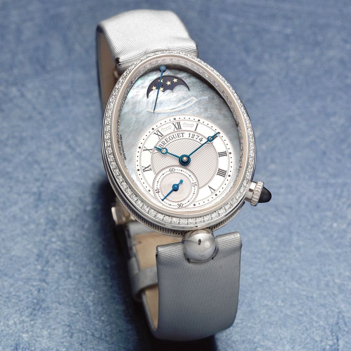 Breguet. A lady's fine 18K white gold and diamond set automatic oval wristwatch with moon phase Reine de Naples, Ref: 8908, Sold 21st November 2003