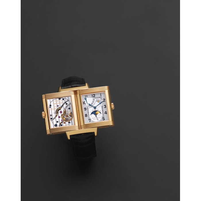Jaeger-LeCoultre. An 18K gold manual wind reversible rectangular wristwatch with day and night indication, moon phase and power reserve Reverso Night & Day, Ref: 270.2.63, Sold 21st May 2001