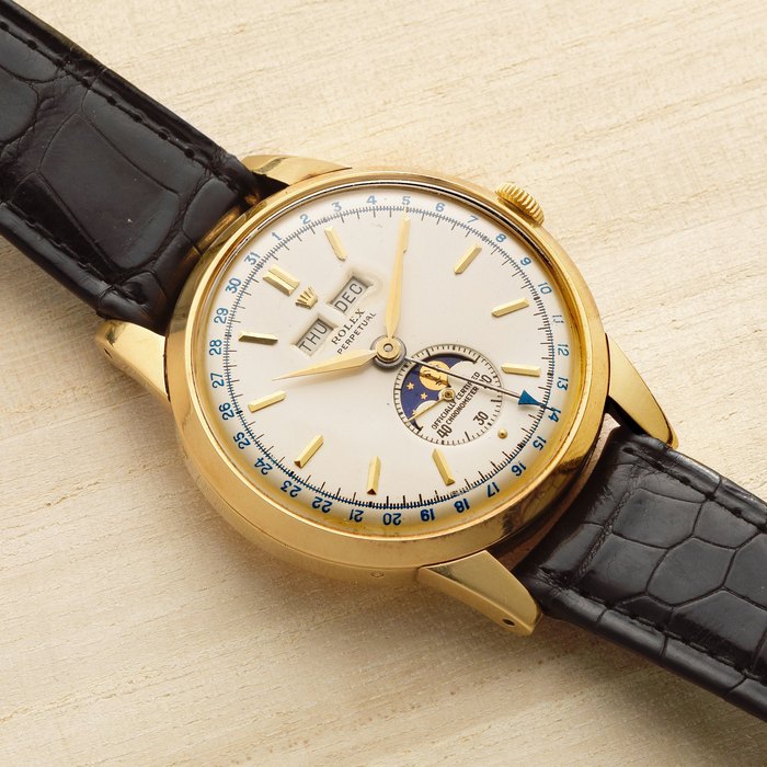Rolex Rolex. A very rare 18K gold automatic triple calendar wristwatch with moon phase Padellone, Ref: 8171, Circa 1955, Price & Market Data