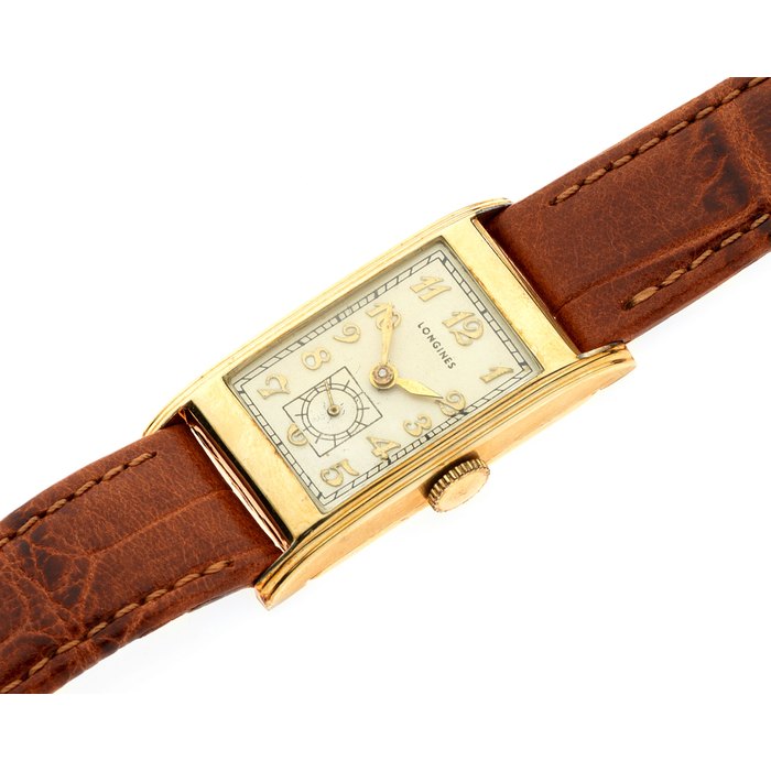 Longines. A gold plated manual wind rectangular wristwatch