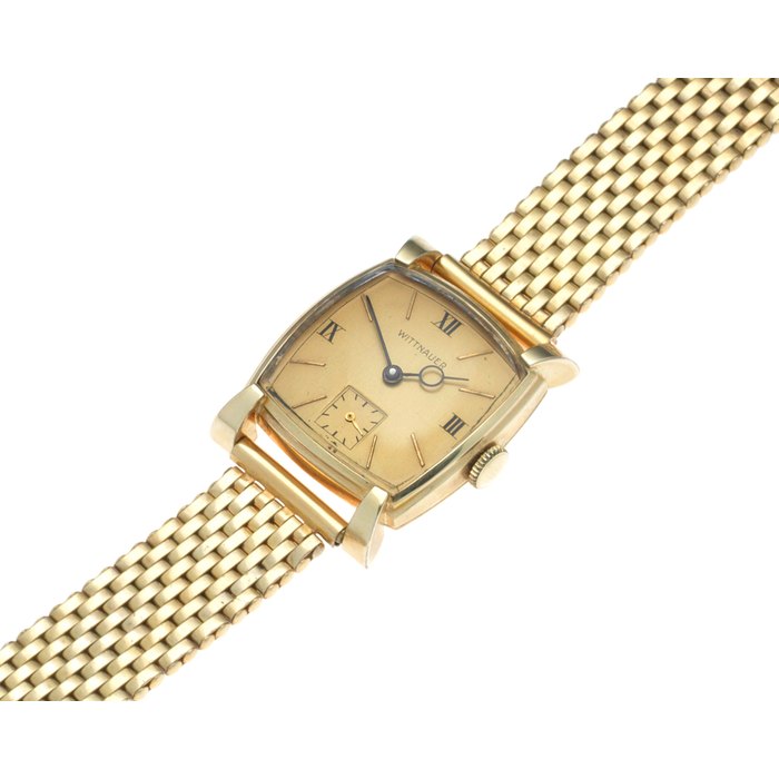 Longines Wittnauer. A gold plated manual wind cushion form bracelet watch