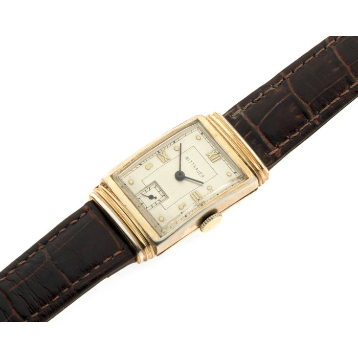 Wittnauer. A gold plated manual wind rectangular wristwatch with faceted glass