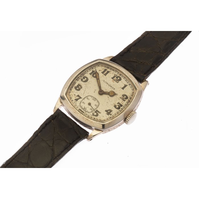 Longines. A silver manual wind wristwatch