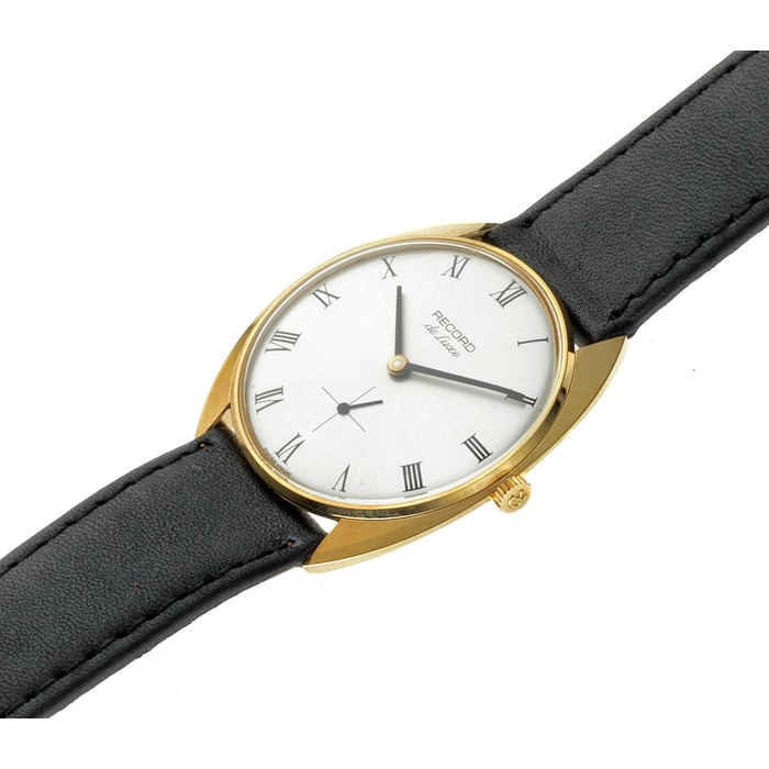 Record. A gold plated and stainless steel manual wind wristwatch Model: de Luxe Ref. 711089