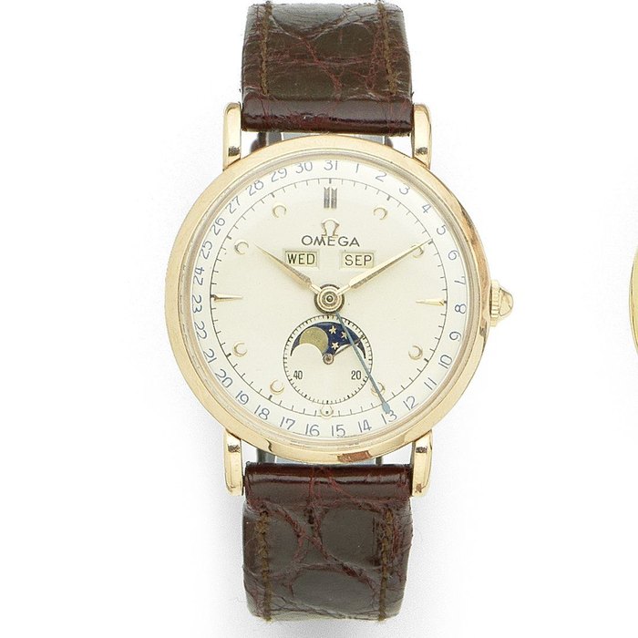 Omega. A 14K rose gold manual wind triple calendar wristwatch with moon phase Ref:2473, Case No.11116543, Movement No.12877133, Circa 1950