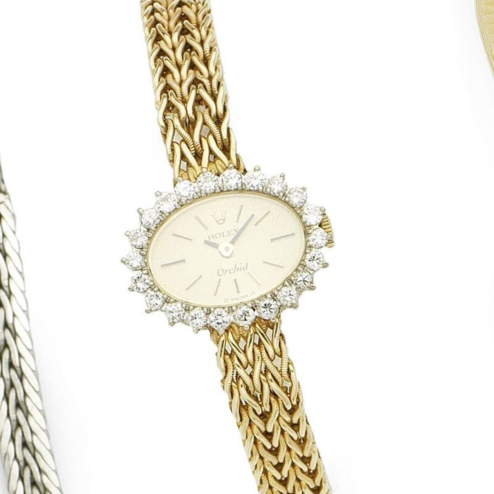 Rolex Rolex. A lady's 18K gold and diamond set manual wind bracelet watch Orchid, Ref:2655, Serial No.409****, Circa 1974, Price & Market Data