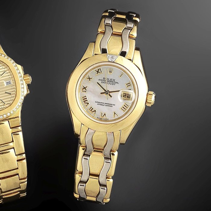Rolex. A lady's mother of pearl 18K gold and diamond set automatic calendar bracelet watch Pearlmaster Datejust, Ref:69328, Serial No.W05****, Movement No.239*****, Circa 1994