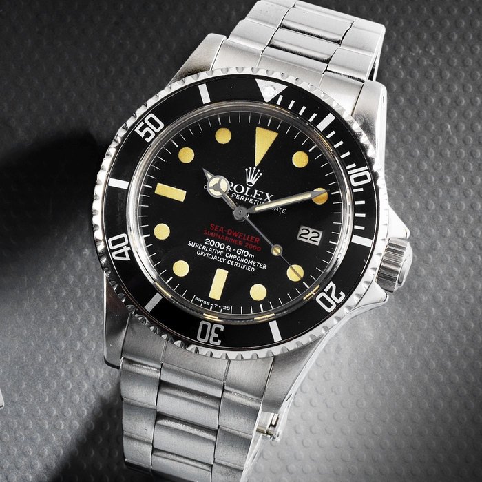 Rolex. A stainless steel automatic calendar bracelet watch 'Double Red' Sea-Dweller, Ref:1665, Serial No.529****, Movement No.D46****, Circa 1977