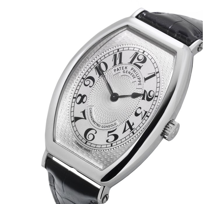 Patek Philippe. A platinum tonneau manual wind wristwatch Chronometro Gondolo, Ref:5098P-001, Case No.4439662, Movement No.3708546, Sold 14th April 2008