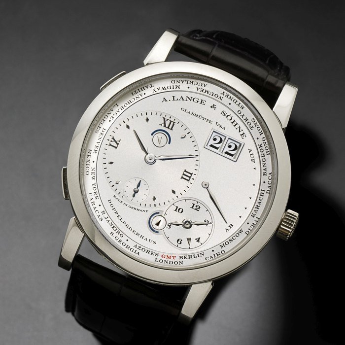 A. Lange & Söhne A. Lange & Söhne. A fine platinum manual wind world time calendar dual time zone wristwatch with power reserve Lange 1 Zeitzone, Ref:116.025, Case No.167503, Movement No.57538, Sold 31st March 2007 · 116.025