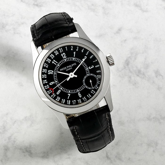 Patek Philippe. An 18K white gold automatic calendar wristwatch Ref:6000G, Movement No.3510255, Circa 2005