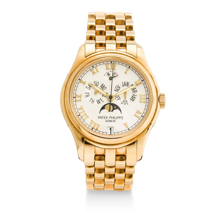 Patek Philippe. A fine 18K gold automatic center seconds bracelet watch with annual calendar, moon phase and power reserveRef:5036/1J-001, Case no. 4052028, Movement no. 3143334, sold 1999