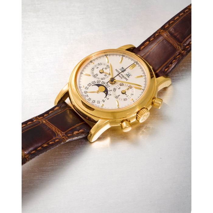 Patek Philippe. A fine 18K gold chronograph wristwatch with perpetual calendar and moon phaseRef:3970E, Movement No. 3046987, Case No. 4225171, Manufactured in 2001