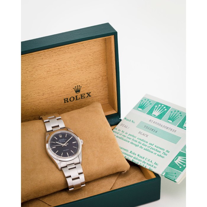 Rolex. A stainless steel automatic centre seconds bracelet watch with original papers and boxAir-King, Ref:14000, No. T252814, Circa 1996