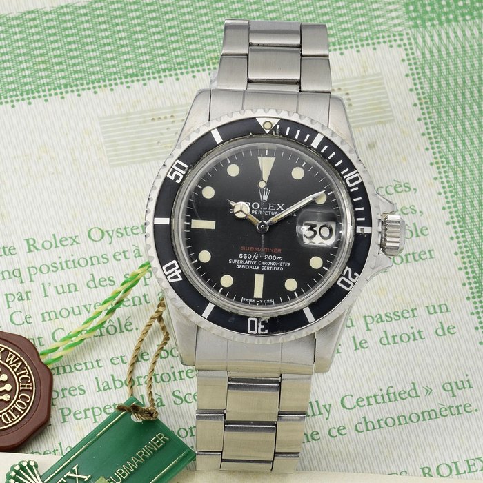 Rolex. A fine and rare stainless steel automatic calendar bracelet watch with original certificate and punched guarantee 'Red Submariner', Ref:1680, Serial No.3065***, Sold 22nd October 1973