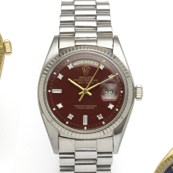 Rolex. A fine and rare 18ct white gold and diamond set automatic calendar bracelet watch Day-Date, Ox-Blood, Ref:1803, Serial No.418****, Movement No.DD99*****, Circa 1975