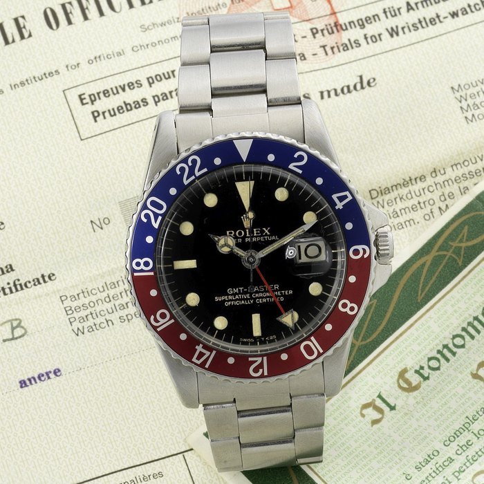 Rolex Rolex. A fine and rare stainless steel automatic calendar bracelet watch with dual time-zone indication and original chronometer certificate GMT Master, Ref:1675, Serial No.1039***, Movement No.D84334, Sold 11th October 1965 · 1675
