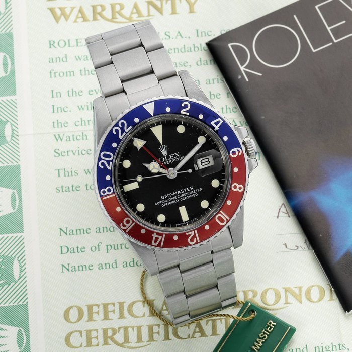 Rolex Rolex. A rare stainless steel automatic calendar bracelet watch with dual time-zone indication, together with punched guarantee certificate GMT-Master, Ref:16750, 8189***, Sold 25th December 1983 · 16750