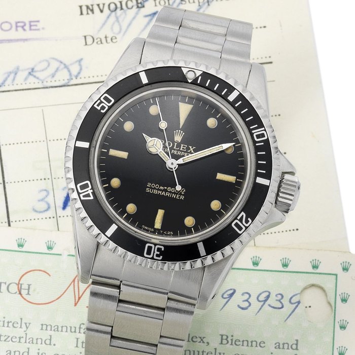 Rolex. A fine and rare stainless steel automatic bracelet watch together with service papers, original receipt and with guarantee card Submariner, Ref:5513,Serial No. 1193***, Sold 18th July 1966
