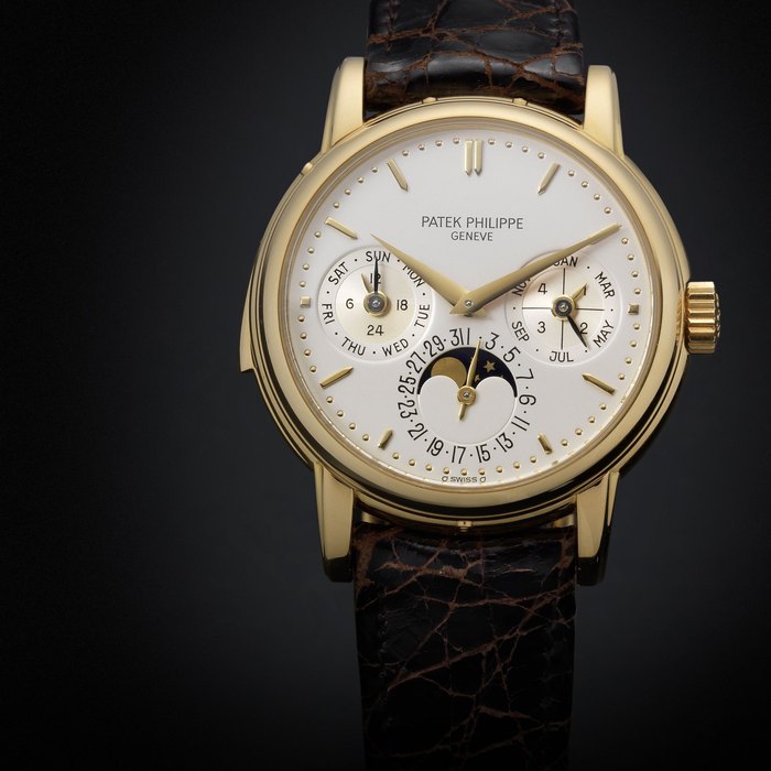 Patek Philippe. A fine and rare 18ct gold automatic perpetual calendar minute repeating wristwatch with moon phase together with fitted box and original Certificate of Origin Ref:3974/J, Case No.2865066, Movement No.1906007, Sold 6th October 1989