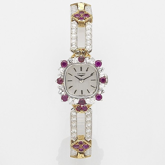 Longines. A lady's 18ct two colour gold diamond and ruby set manual wind bracelet watch Ref:4509, Case No.17395312, Movement No.50843755, Circa 1985