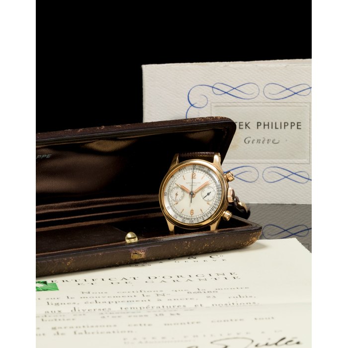 Patek Philippe. A rare and very fine 18K rose gold water resistant chronograph wristwatch with original guarantee certificate and boxRef:1463, Case no. 664960, Movement no. 868180 , sold 1952