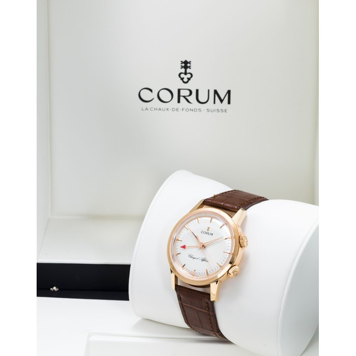 Corum Corum. A fine 18K rose gold limited edition center seconds alarm wristwatchChargé d'Affaires, no. 027 / 150, serial no. 2295331, circa 2012, Price & Market Data