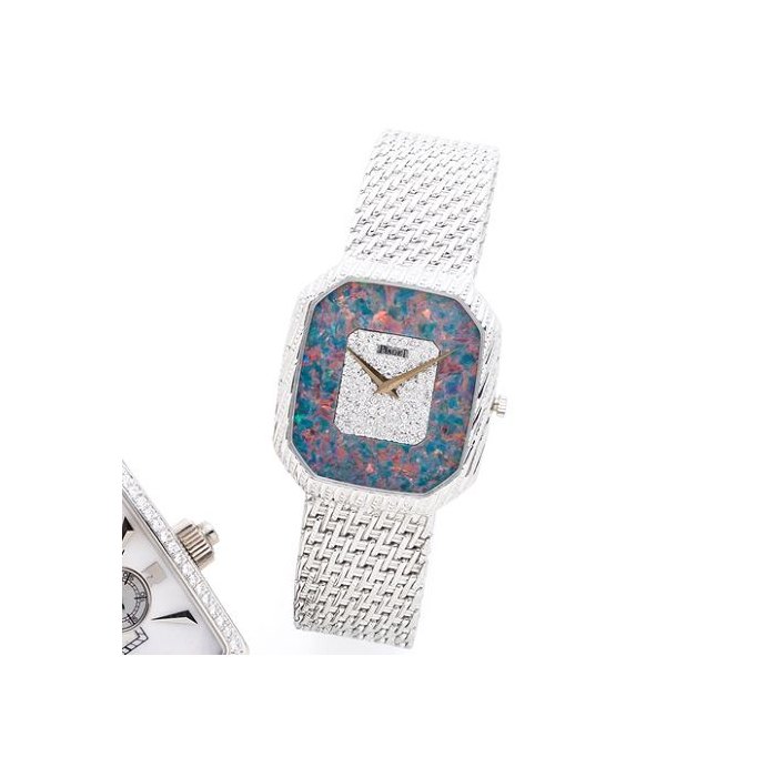 Piaget. An 18K white gold, opal and diamond set manual wind bracelet watch Ref:9792P31, Case No.423844, Circa 1990