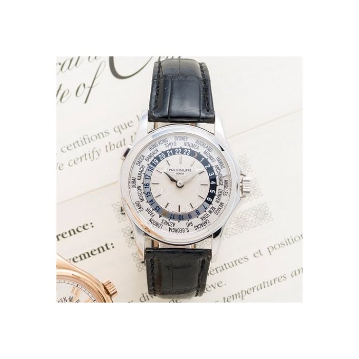 Patek Philippe. An 18K white gold automatic world time wristwatchRef:5110, Case No.4142074, Movement No.3207265, retailed by Patek Philippe Salons de Geneve 7th August 2001
