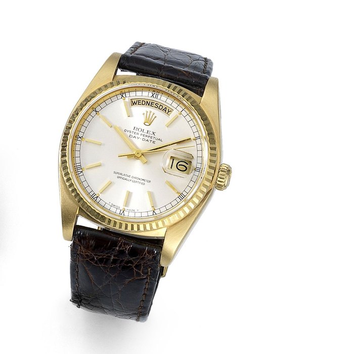 Rolex. An 18K gold automatic calendar wristwatch Day-Date, Ref:18038, Serial No.806****, Movement No.215****, Circa 1983