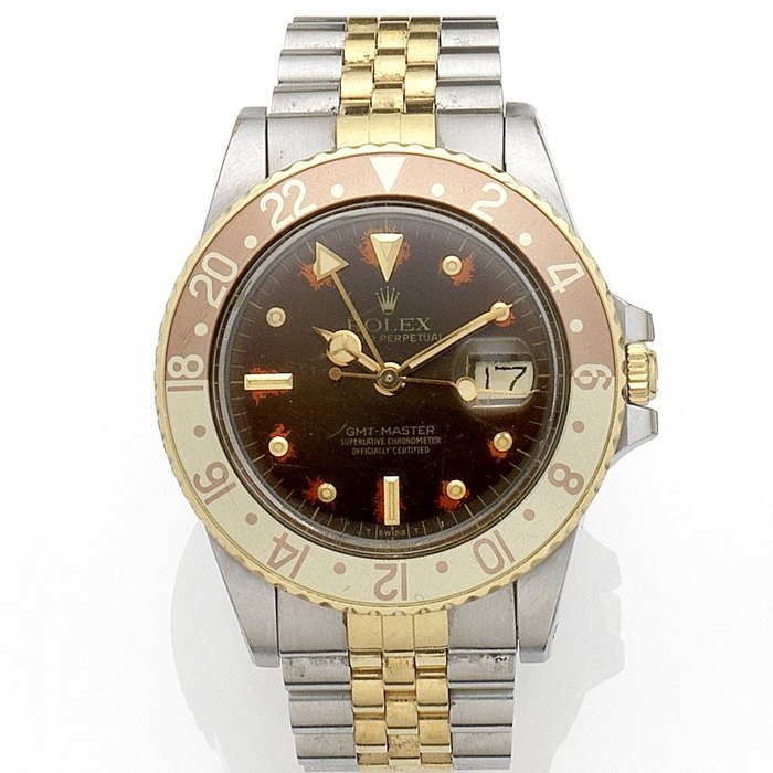 Rolex Rolex. A stainless steel and gold automatic calendar bracelet watch with dual time zone GMT-Master, Ref:16753, Serial No.840****, Movement No.106****, Circa 1985 · 16753