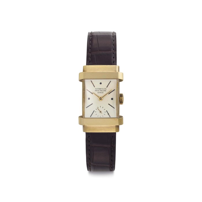 Patek Philippe. An 18k Gold Wristwatch with Hooded Lugs Signed Patek Philippe, Genève, Retailed by Tiffany & Co., Ref. 1450, Movement No. 974'537, Case No. 673'370, Manufactured in 1952