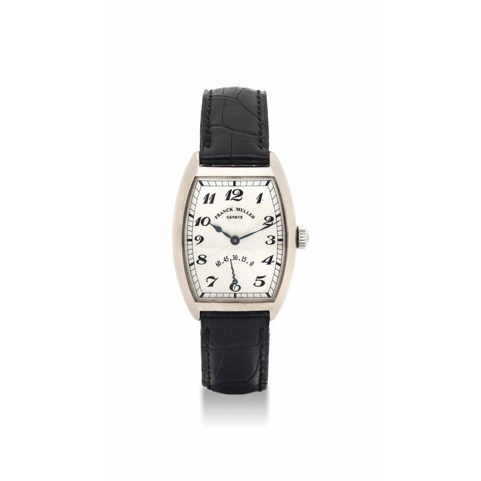 FRANCK MULLER. AN 18K WHITE GOLD TONNEAU-SHAPED WRISTWATCH WITH RETROGRADE SECONDS