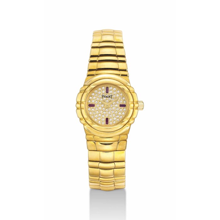 PIAGET. A LADY'S 18K GOLD, DIAMOND AND RUBY-SET BRACELET WATCH SIGNED PIAGET, TANAGRA MODEL, REF. GOA 15264, CASE NOS. A 025 AND 541'240, CIRCA 2000