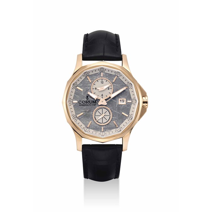 CORUM. A FINE 18K PINK GOLD AUTOMATIC LIMITED EDITION DODECAGON-SHAPED DUAL TIME WRISTWATCH WITH DATE AND METEORITE DIAL SIGNED CORUM, ADMIRAL'S CUP LEGEND 42 MODEL, NO. 03/75, CASE NO. 2'309'490, CIRCA 2013