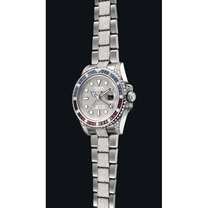 ROLEX. A FINE AND RARE 18K WHITE GOLD, RUBY, SAPPHIRE AND DIAMOND-SET AUTOMATIC DUAL TIME WRISTWATCH WITH SWEEP CENTRE SECONDS, DATE AND BRACELET SIGNED ROLEX, GMT MASTER II MODEL, REF. 116759, CASE NO. M060409, CIRCA 2007