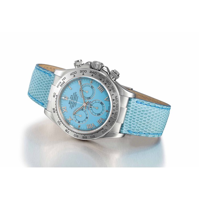 Rolex ROLEX. A RARE 18K WHITE GOLD AUTOMATIC CHRONOGRAPH WRISTWATCH WITH TURQUOISE BLUE DIAL SIGNED ROLEX, OYSTER PERPETUAL, COSMOGRAPH DAYTONA MODEL, REF. 116519, CASE NO. P515921, CIRCA 2000, Price & Market Data
