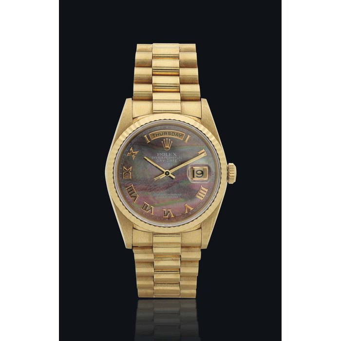 ROLEX. A VERY FINE AND ELEGANT 18K GOLD AUTOMATIC WRISTWATCH WITH SWEEP CENTRE SECONDS, DATE, MOTHER-OF-PEARL DIAL AND BRACELET SIGNED ROLEX, OYSTER PERPETUAL, DAY-DATE MODEL, REF. 18238, CASE NO. E348341, CIRCA1990