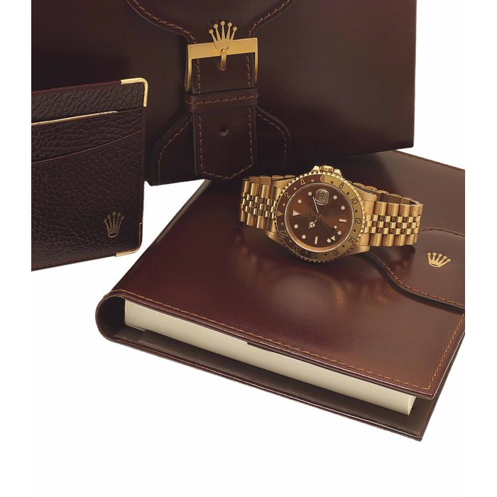 ROLEX. AN 18K GOLD AUTOMATIC DUAL TIME WRISTWATCH WITH SWEEP CENTRE SECONDS, DATE AND BRACELET SIGNED ROLEX, OYSTER PERPETUAL DATE GMT-MASTER II MODEL, REF. 16718, CASE NO. N281346, CIRCA 1991
