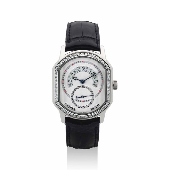 DANIEL ROTH. A FINE 18K WHITE GOLD AND DIAMOND-SET TONNEAU-SHAPED AUTOMATIC WRISTWATCH WITH RETROGRADE HOURS AND DATE SIGNED DANIEL ROTH, PREMIER RETROGRADE MODEL, REF. 807.L.10, CASE NO. 10'364, CIRCA 2000