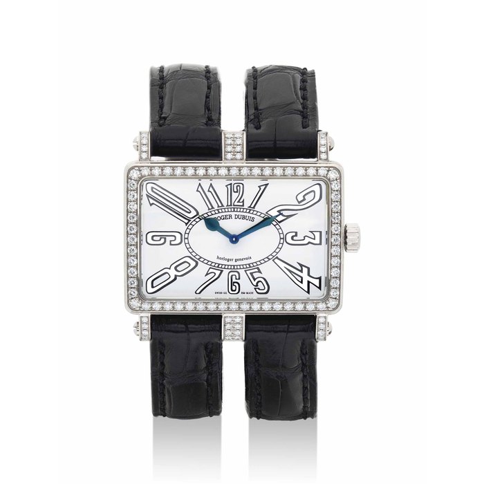 ROGER DUBUIS. A LADY'S 18K WHITE GOLD AND DIAMOND-SET LIMITED EDITION RECTANGULAR WRISTWATCH SIGNED ROGER DUBUIS, HORLOGER GENEVOIS, TOO MUCH MODEL, NO. 17/28, CIRCA 2006