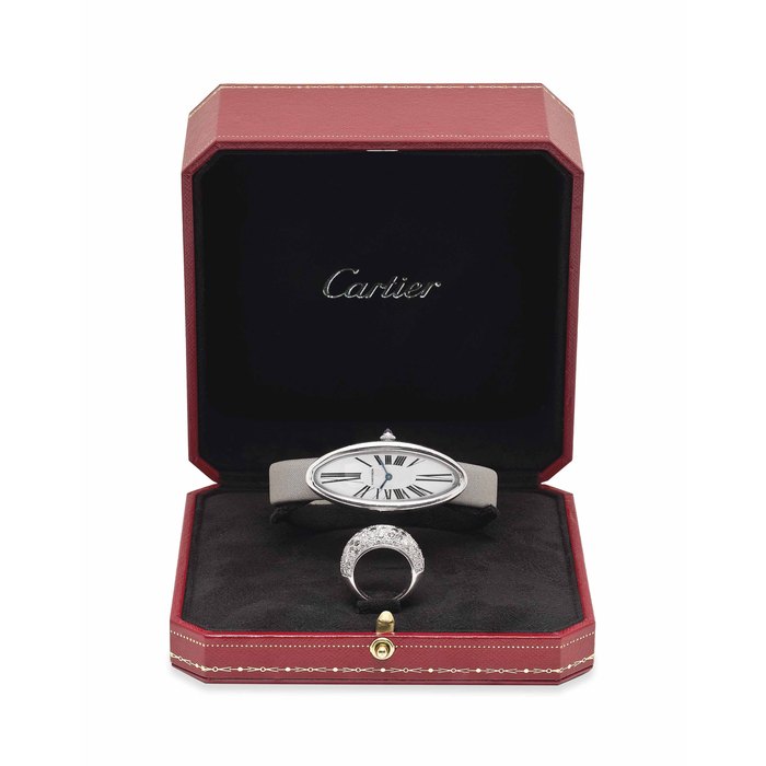 CARTIER. A LADY'S FINE 18K WHITE GOLD ELONGATED OVAL WRISTWATCH WITH AN 18K WHITE GOLD AND DIAMOND-SET COCKTAIL RING SIGNED CARTIER. BAIGNOIRE ALONGEE MODEL, REF. 2514, CASE NO. 118058AF, CIRCA 2008