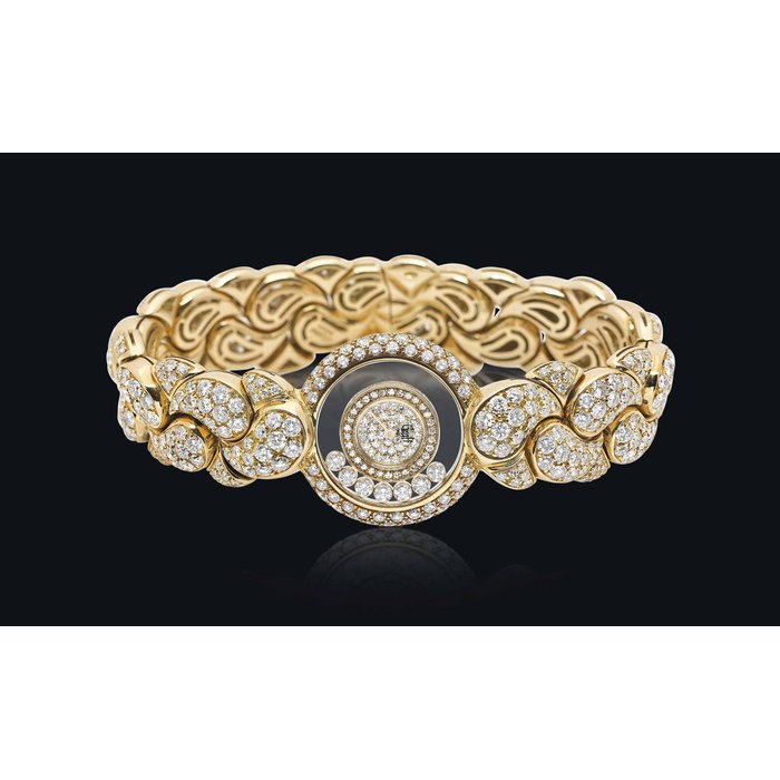 GRAFF BY CHOPARD. A LADY'S VERY FINE 18K GOLD AND DIAMOND-SET BRACELET WATCH SIGNED GRAFF, LONDON, HAPPY DIAMONDS MODEL, REF. 43/5858, CASE NO. 3 32768 4117, CIRCA 1995