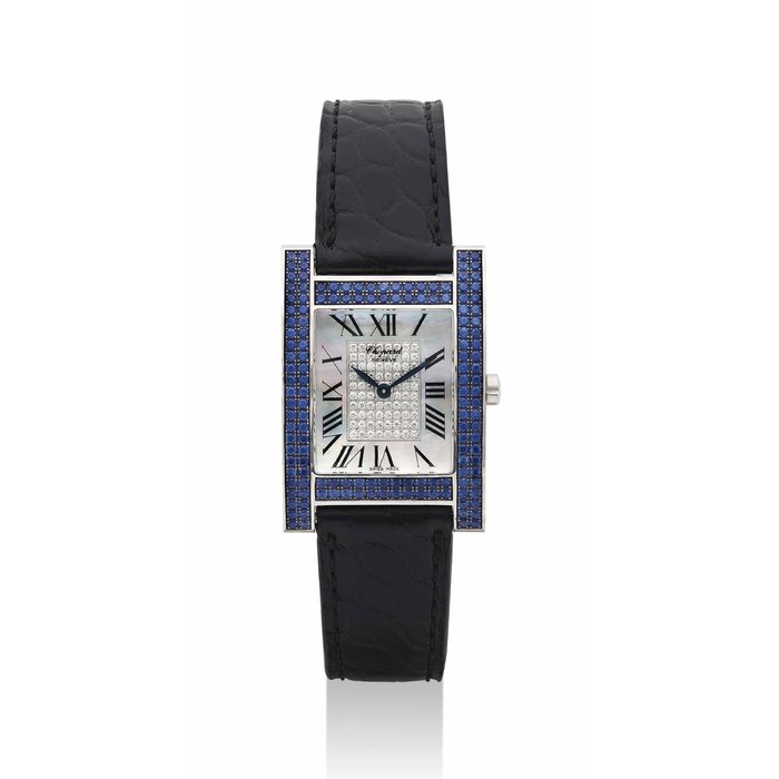 CHOPARD. A LADY'S FINE 18K WHITE GOLD, SAPPHIRE AND DIAMOND-SET RECTANGULAR WRITSTWATCH WITH MOTHER-OF-PEARL DIAL SIGNED CHOPARD, GENEVE, YOUR HOUR MODEL, REF. 17/3451/8-23, CASE NOS. 531'977 AND 459 1, CIRCA 2000
