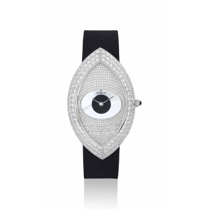 CORUM. A LADY'S FINE 18K WHITE GOLD AND DIAMOND-SET LOZANGE-SHAPED WRISTWATCH WITH MOTHER-OF-PEARL AND BLACK LAQUERED DIAL SIGNED CORUM, REF. 137'250'69, CASE NO.774658, CIRCA 2000