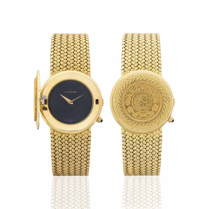 JAEGER-LECOUTRE. A VERY RARE 18K GOLD COIN BRACELET WATCH WITH DARK BLUE DIAL, MADE FOR THE KINGDOM OF SAUDI ARABIA SIGNED JAEGER-LECOULTRE, MOVEMENT NO. 22'766'575, CASE NO. 1'415'421 AND 1'483'581, CIRCA 1960