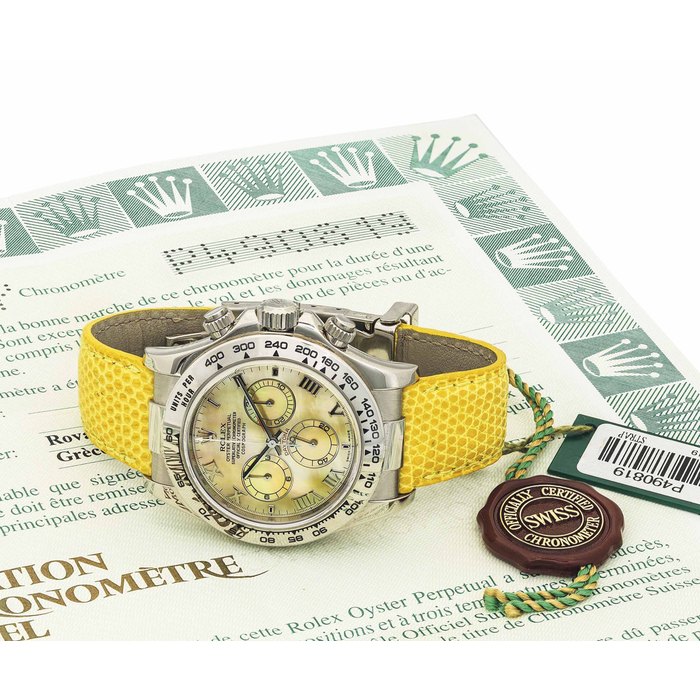 ROLEX. AN ATTRACTIVE 18K WHITE GOLD AUTOMATIC CHRONOGRAPH WRISTWATCH WITH YELLOW MOTHER-OF-PEARL DIAL SIGNED ROLEX, OYSTER PERPETUAL, COSMOGRAPH DAYTONA, BEACH MODEL, REF. 116519, CASE NO. P490819, CIRCA 2000