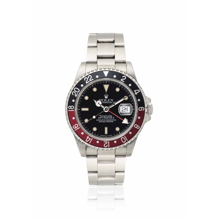 ROLEX. A RARE STAINLESS STEEL AUTOMATIC DUAL TIME WRISTWATCH WITH SWEEP CENTRE SECONDS, DATE AND BRACELET SIGNED ROLEX, RETAILED BY TIFFANY, OYSTER PERPETUAL DATE, GMT-MASTER II, REF. 16710, CASE NO. E676932, CIRCA 1990