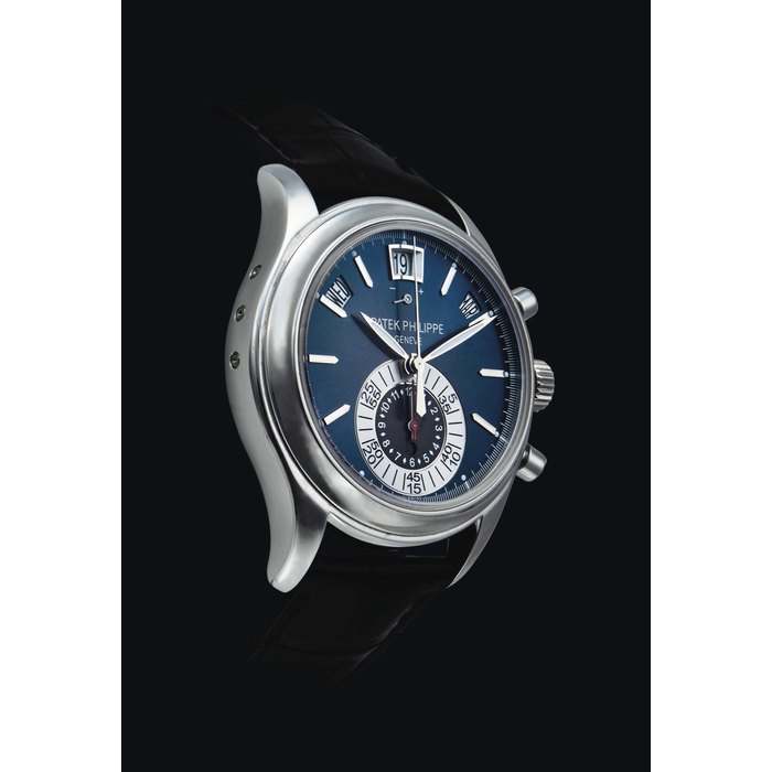 PATEK PHILIPPE. A PLATINUM AUTOMATIC ANNUAL CALENDAR CHRONOGRAPH WRISTWATCH WITH DAY AND NIGHT INDICATION AND POWER RESERVE SIGNED PATEK PHILIPPE, GENEVE, REF. 5960P-015, MOVEMENT NO. 5'574'015, CASE NO. 4'541'203, CIRCA 2011