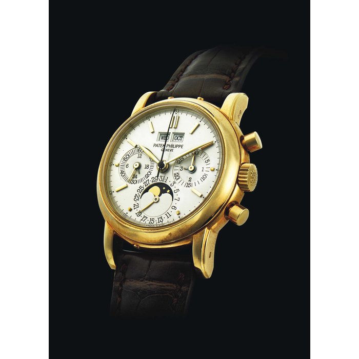 PATEK PHILIPPE. AN 18K GOLD PERPETUAL CALENDAR CHRONOGRAPH WRISTWATCH WITH MOON PHASES AND LEAP YEAR INDICATION SIGNED PATEK PHILIPPE, GENEVE, REF. 3970E, MOVEMENT NO. 875’655, CASE NO. 2’873’883, MANUFACTURED IN 1990